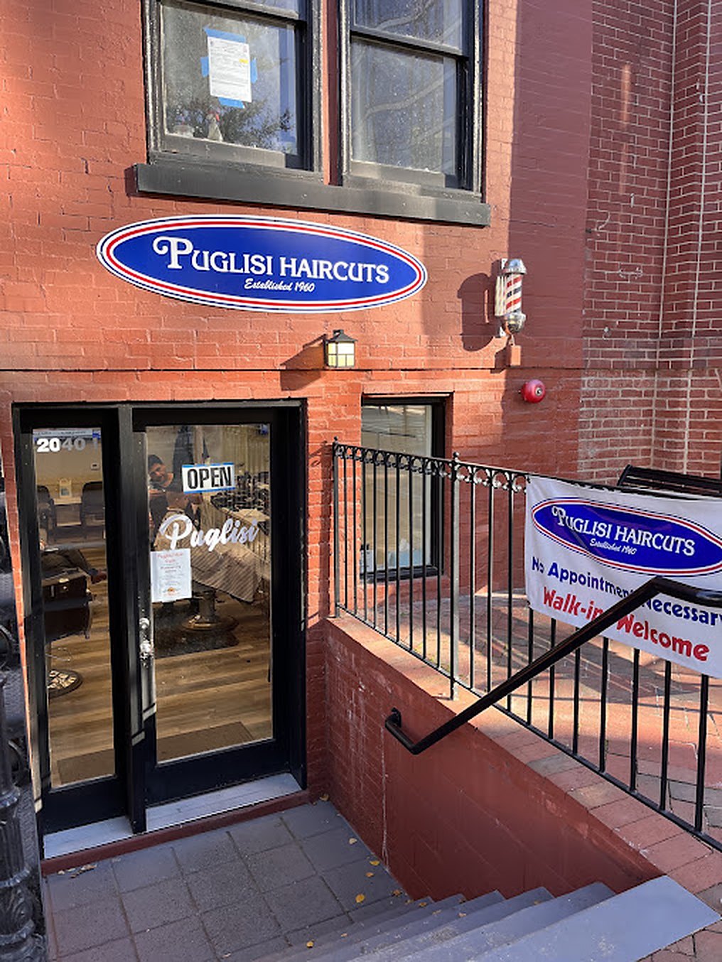 Walk-ins Welcome banner on the rail at the Puglisi entrance